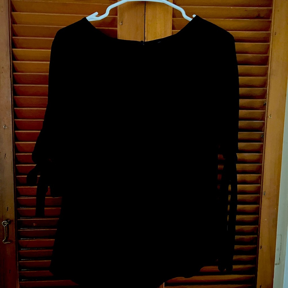 Ann Taylor size small black blouse with tie sleeves.